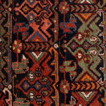 A rug, a semi-antique/an old Garaghan, ca 223 x 135-141 cm.