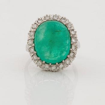 A emerald and brilliant cut diamond ring.