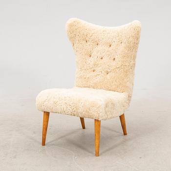 A Swedish Modern 1940s sheep skin armchair.