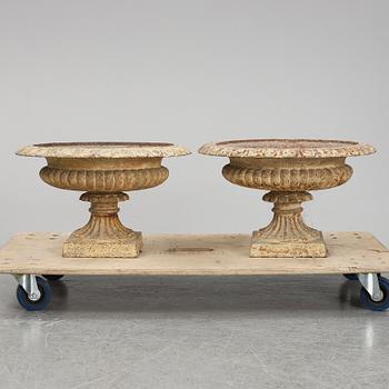 A pair of cast iron plat pots.