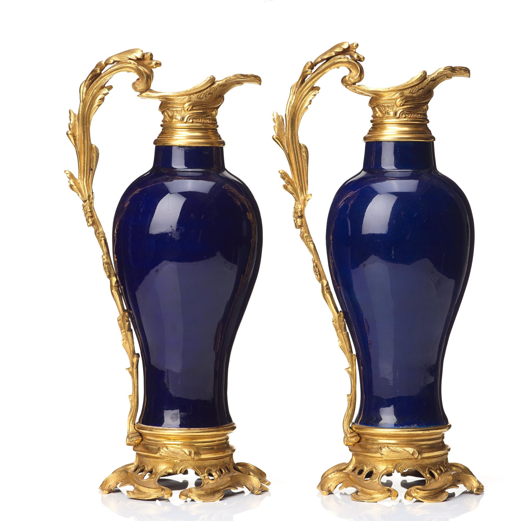 A pair of gilt bronze mounted vases, Qing dynasty, Qianlong (1736-95). French bronze mounts.