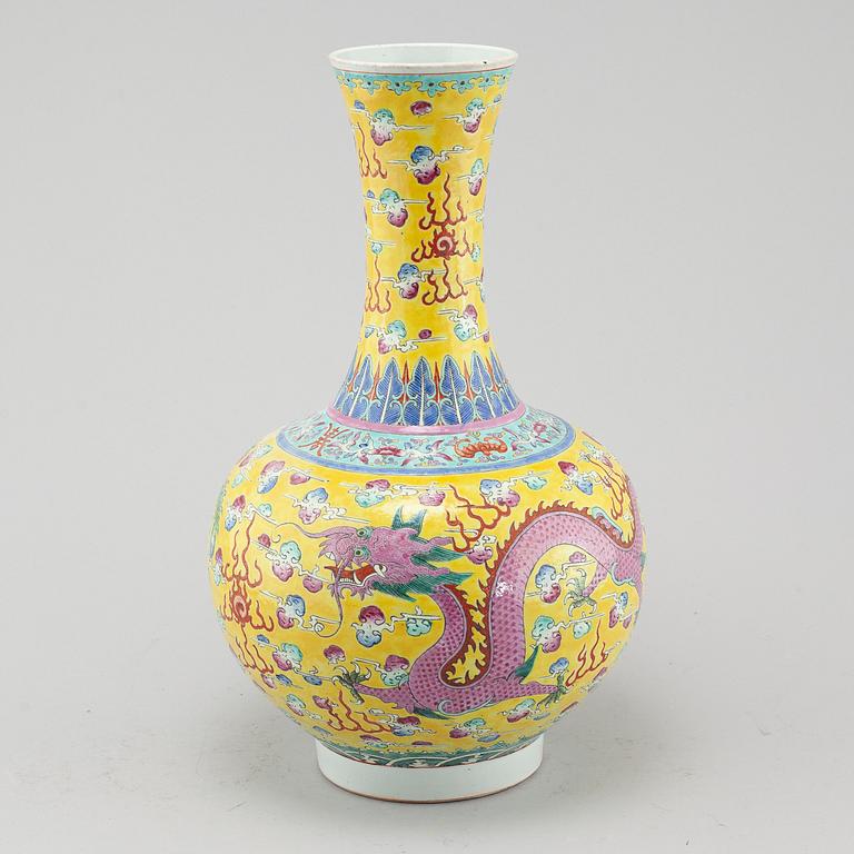 A yellow glazed dragon and phoenix vase, China, circa 1900.