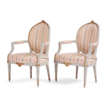 63. A pair of Gustavian carved armchairs, late 18th century.