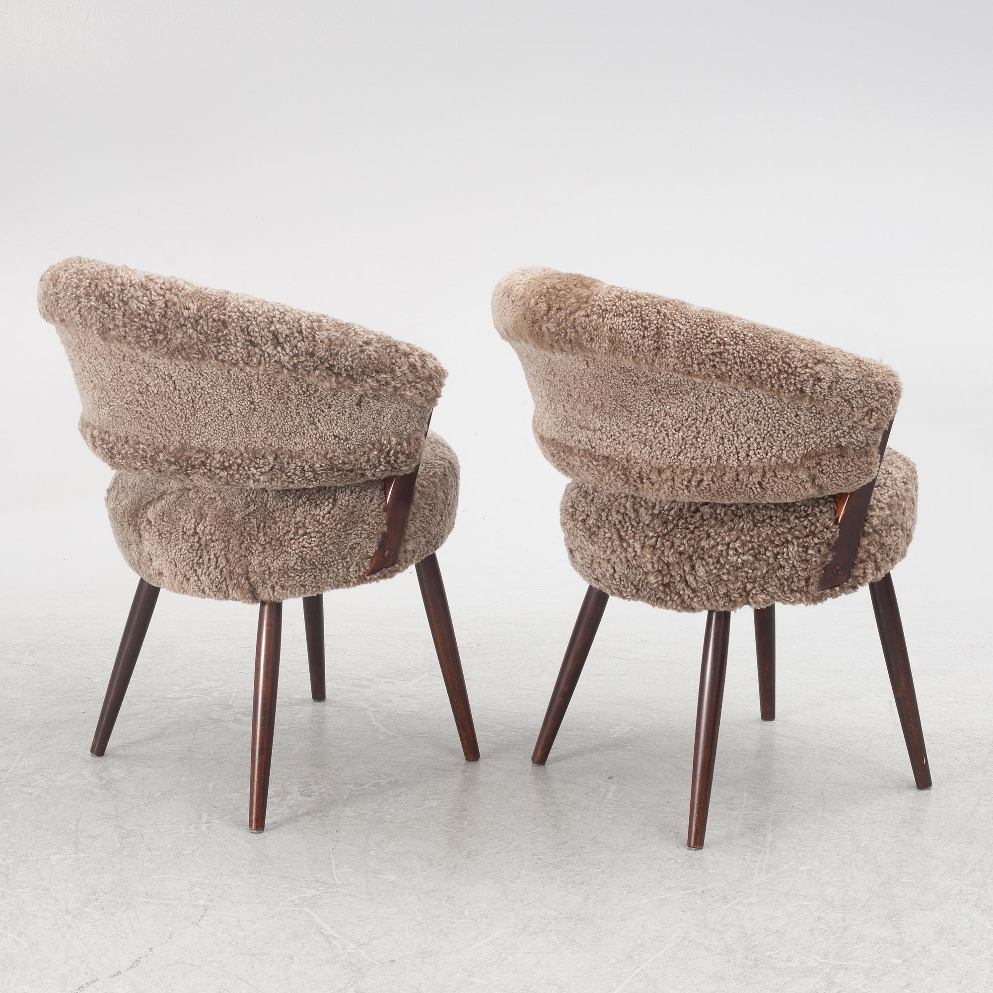 A pair of armchairs, AB Bröderna Biörs Snickerifabrik, mid-20th century.