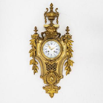 A bronze wall clock, Louis XVI style, France, circa 1900.