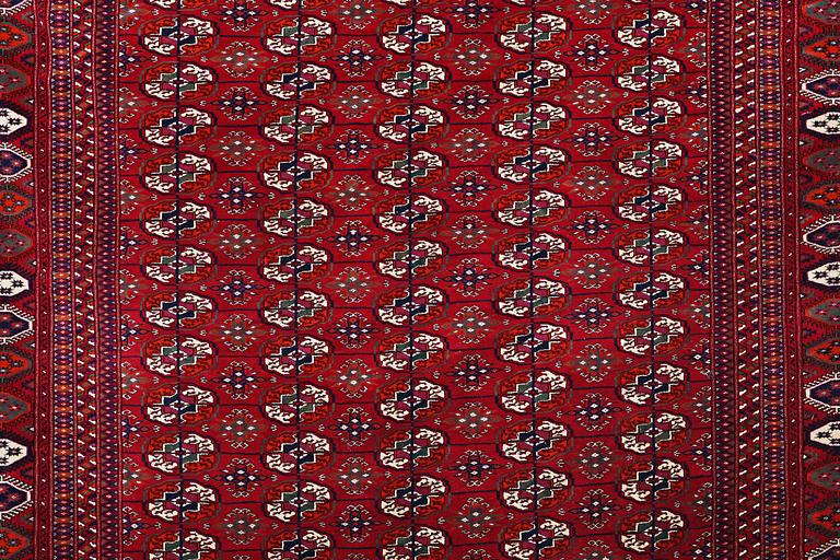 A carpet, semi-antique Tekke, ca 330 x 250 cm.