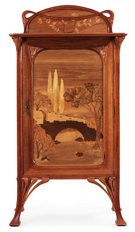 An Art Nouveau mahogany cabinet with inlays and carved decoration, possibly France or Belgium, circa 1900.
