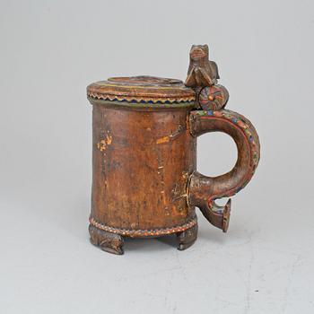 A 19th century painted wooden tankard.