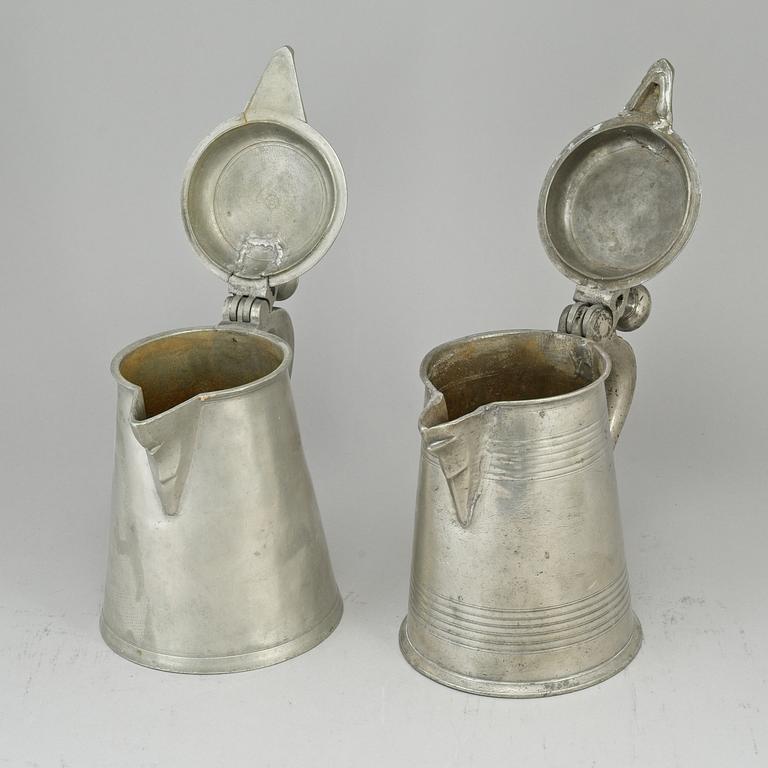 Two pewter tankards, one by Carl Petter Eckerström, Västerås 1833.