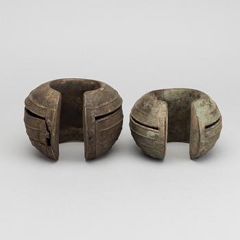 Two bronze currency braclets, Baule, Ivory Coast.