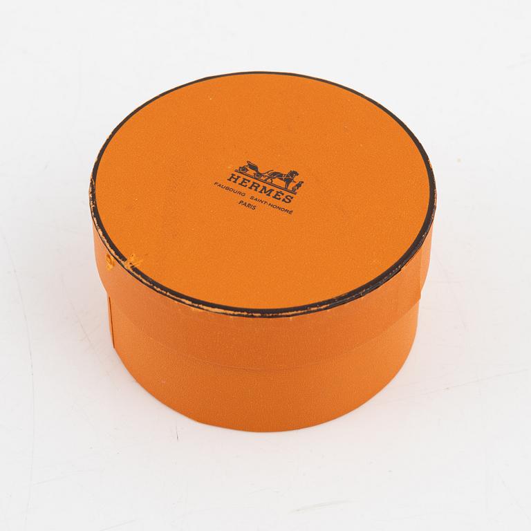 Hermès, a white leather bracelet.