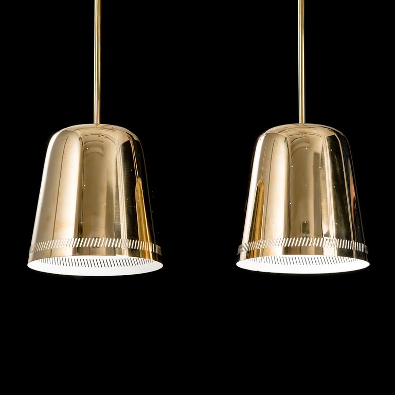 A pair of 1950s/60s pendant lights for Taito, Finland.