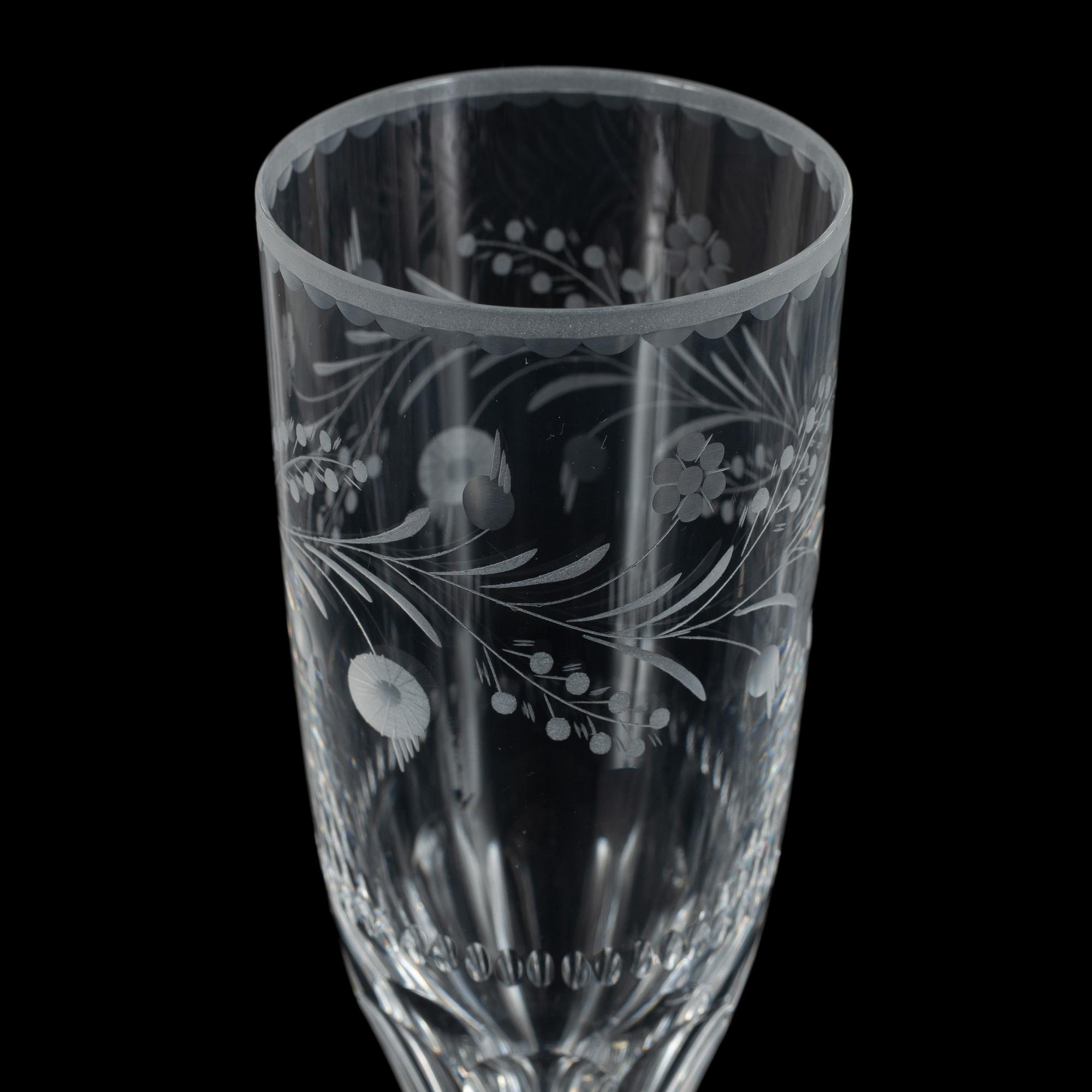 A display cabinet with a 47-piece glass service, "Koskull" from Kosta, Sweden.