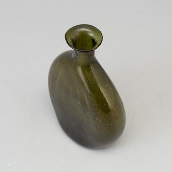 A 18th century glass bottle.