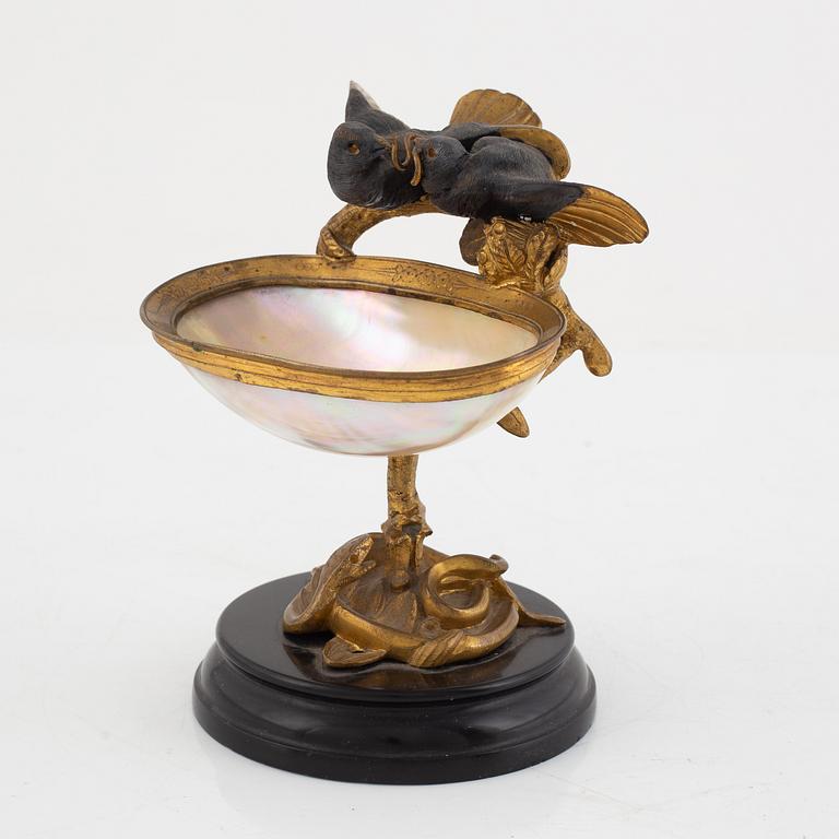 A gilt-bronze and mother of pearl stand for a pocket watch, later part 19th century.