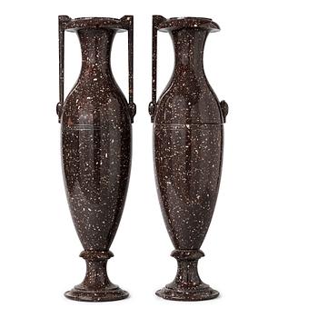 1319. A pair of Swedish late Empire 19th century porphyry urns.