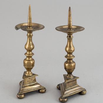 A pair of 17th century bronze candlesticks.
