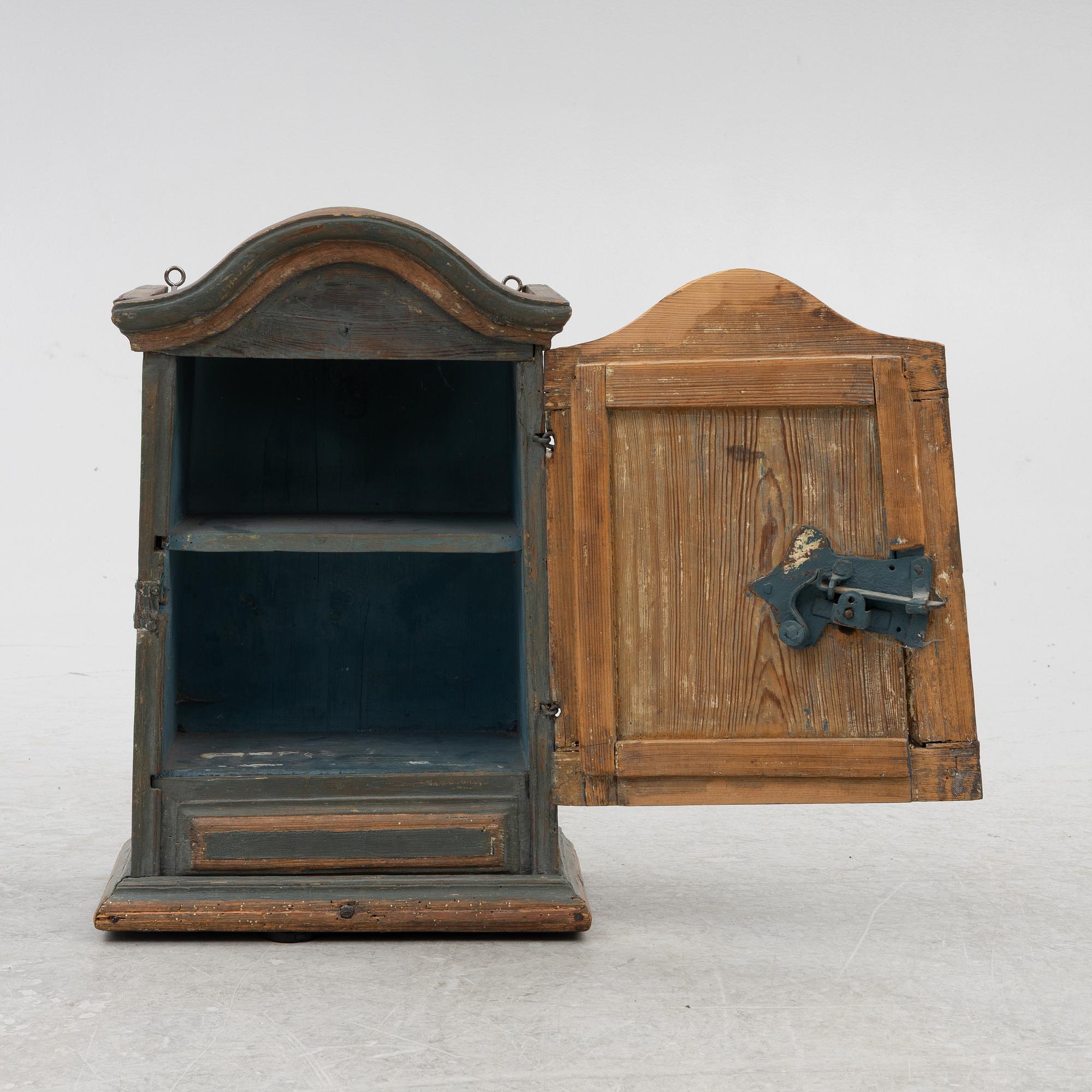 A painted wall cabinet, 19th century.