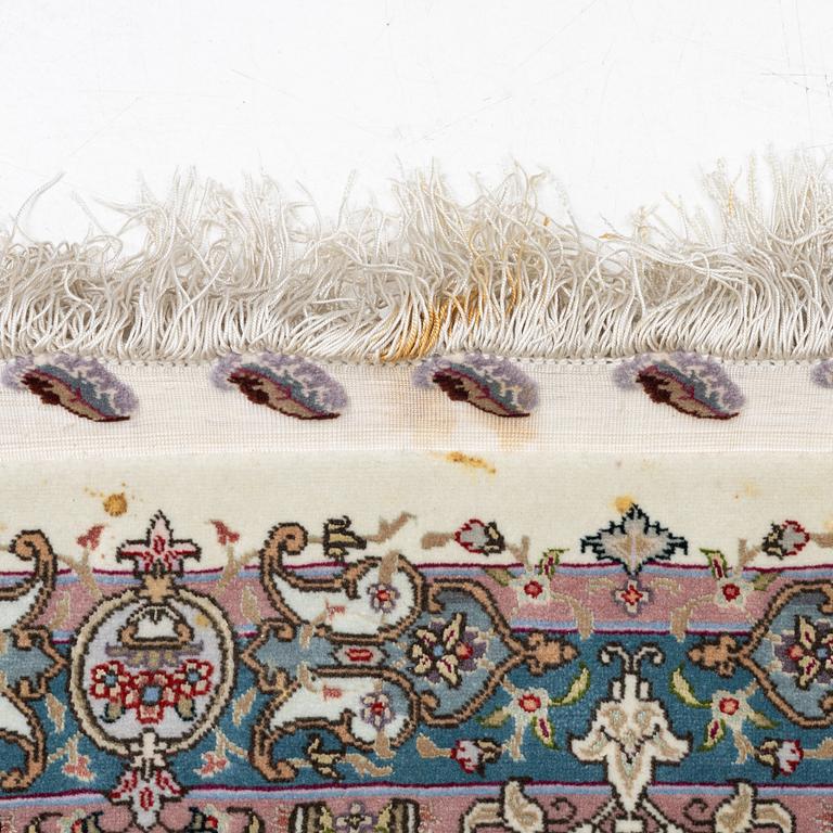 A Tabriz, carpet, 310 x 195 cm. signed.