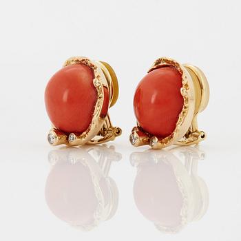 A pair of 18K gold earrings set with coral and round brilliant-cut diamonds.