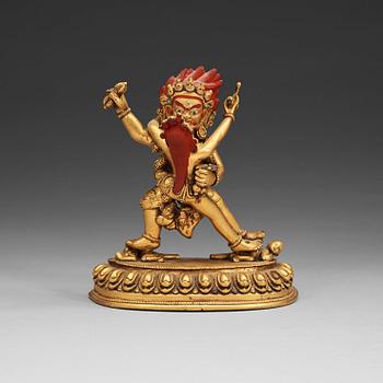 A gilt bronze figure of Vajrapani with consort in yabyum position, Nepal/Tibet, presumably early 20th Century.