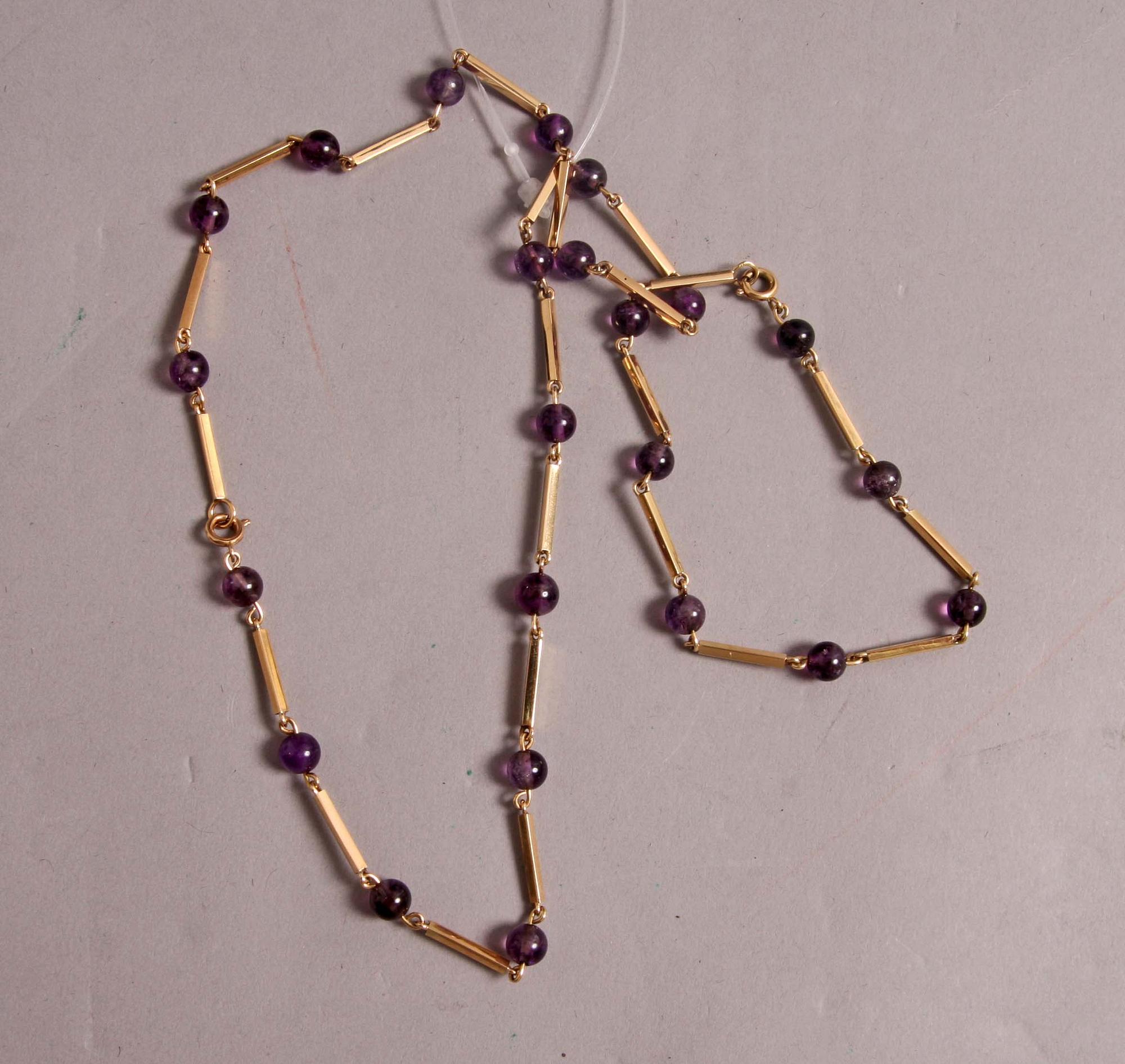 HALSBAND o ARMBAND, guld 18 K, m violetta stenar.