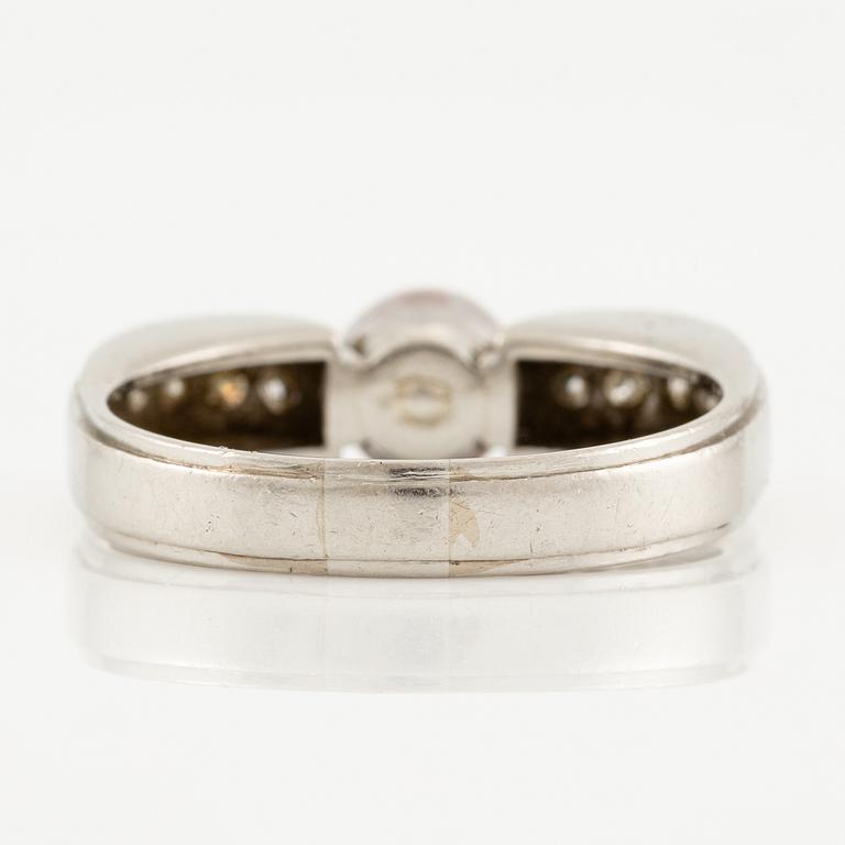 A W.A. Bolin ring in platinum with a pearl and round brilliant-cut diamonds.