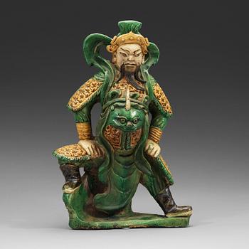 451. A sancai glazed figure of Guandi, Ming dynasty (1368-1644).