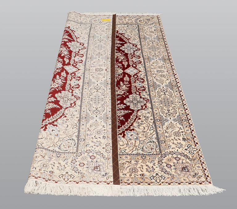A carpet, Nain part silk s.k 6LAA, 239 x 155 cm.