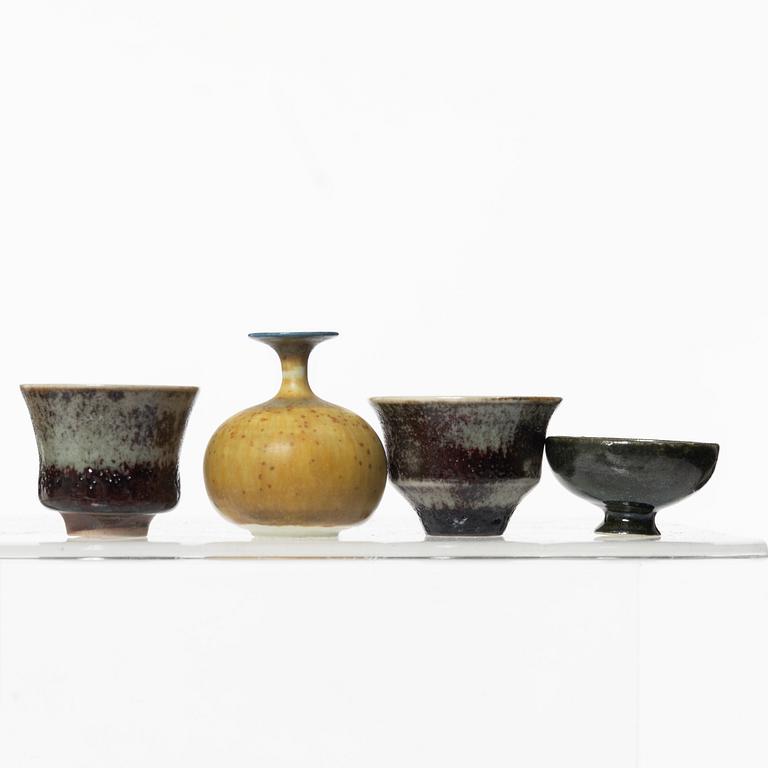 A set of fourteen stoneware vases and ten bowls, predominantly John Andersson, Höganäs.