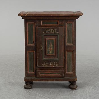 A painted cabinet, marked 1814.
