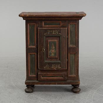 A painted cabinet, marked 1814.