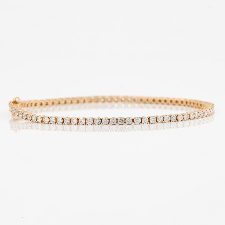 Tennisarmband 18K guld med briljantslipade diamanter.
