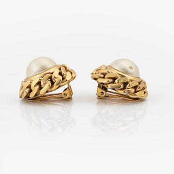 Céline, a pair of gold tone clip-on earrings.