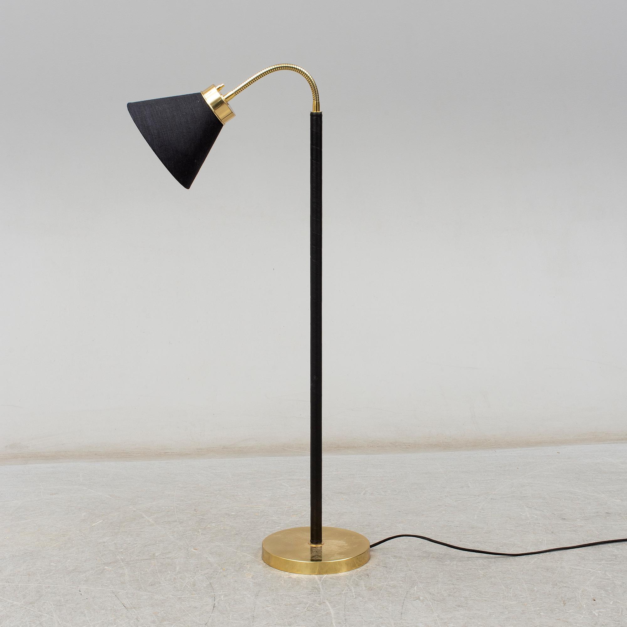 JOSEF FRANK, a brass and leather wrapped floor lamp, model 1838, from Firma Svenskt Tenn.