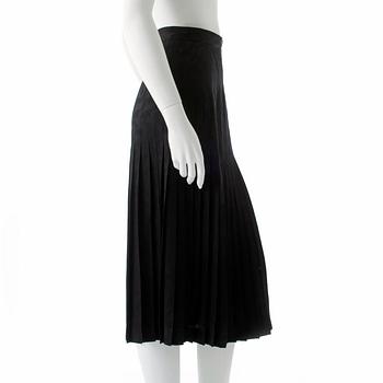 VALENTINO, a black silk skirt.