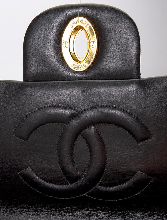 A Chanel maxi jumbo leather bag.