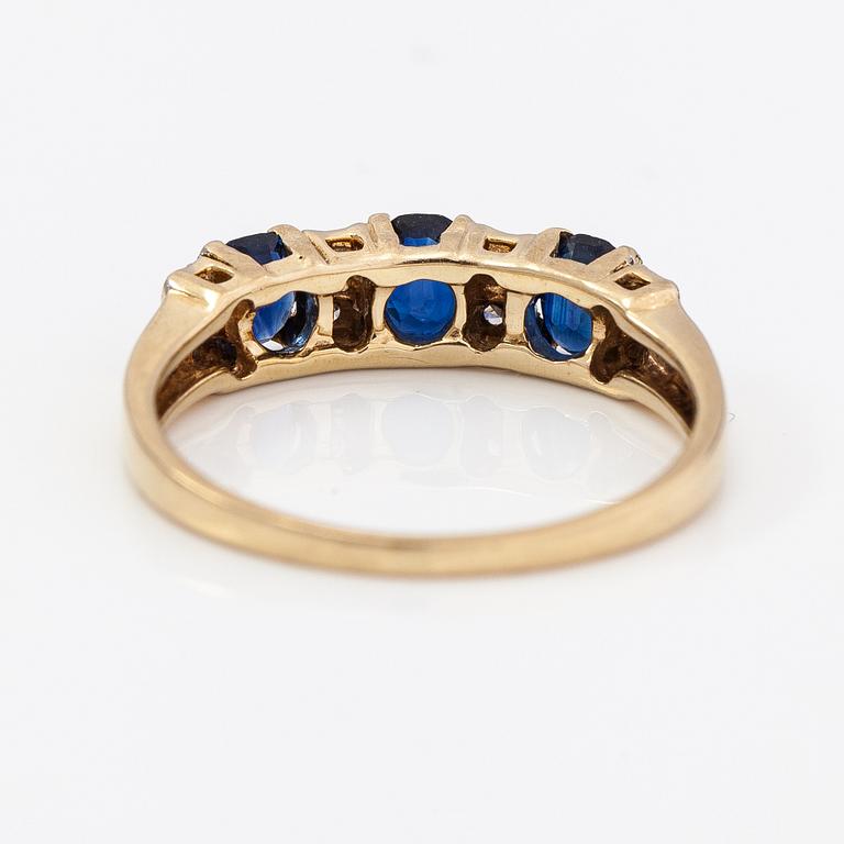 A 14K gold ring with diamonds ca. 0.05 ct and sapphires. Finnish import marks 1990.