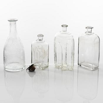 A set of three glass bottles and one decanter, 19th Century.