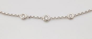 A diamond long chain in 18K white gold set with round brilliant-cut diamonds.