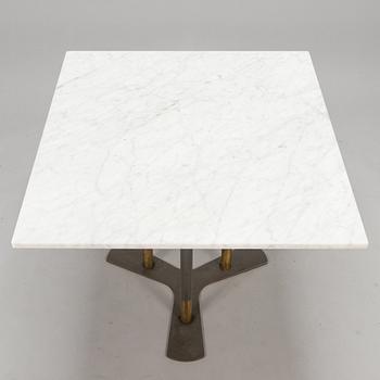 A marble top table, 21th century.