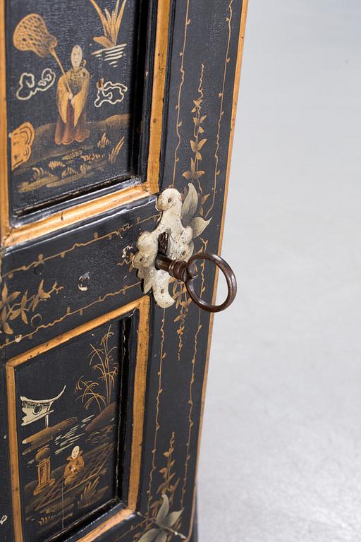 An 18th century corner cabinet.