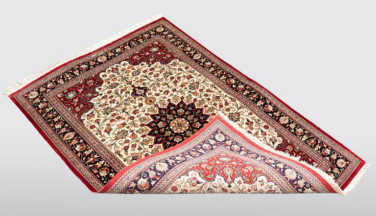 A carpet, Silk Qum, ca 116 x 75 cm.