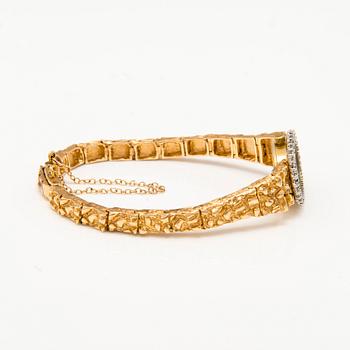 OMEGA, armbandsur, quartz, 14K guld, diamanter ca 0.38 ct tot. 18 mm.