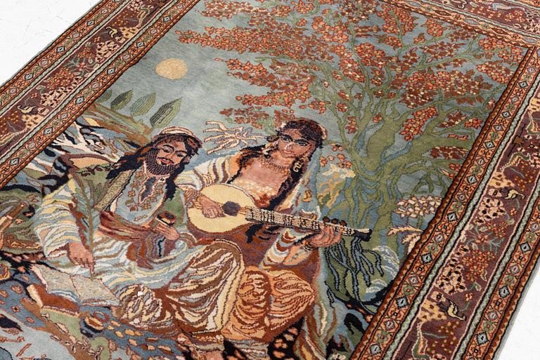 An oriental figural rug, c. 182 x 128 cm.