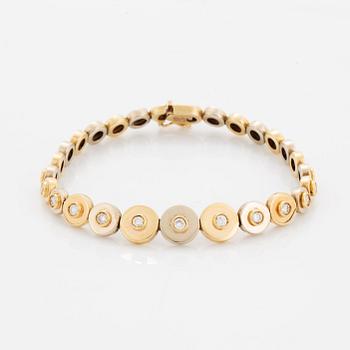 A 14K gold bracelet set with round brilliant-cut diamonds.