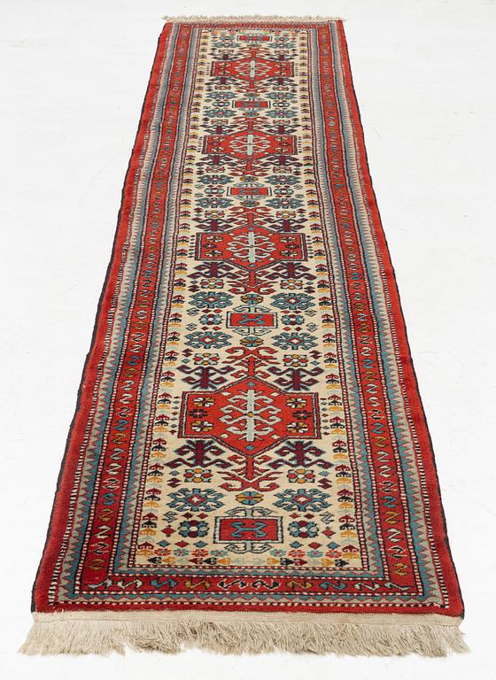 An oriental runner, c. 355 x 75 cm.