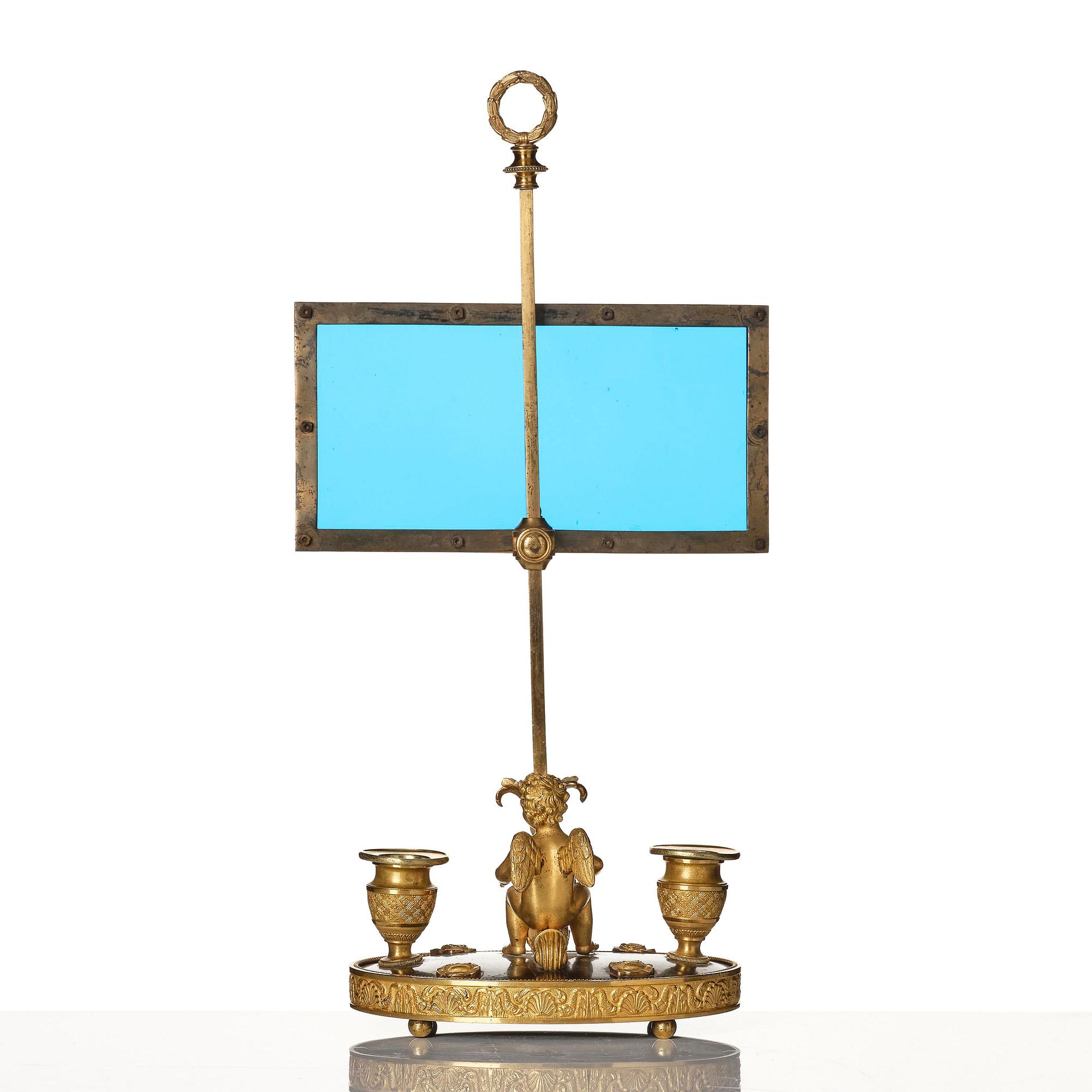 A Russian Empire ormolu and patinated bronse two-light lamp, early 19th century.