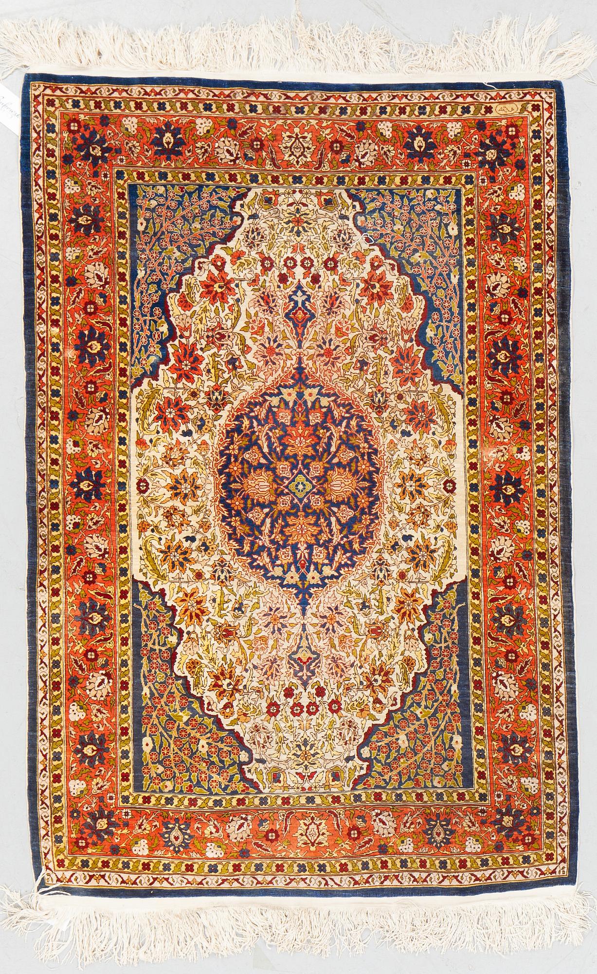 A rug, Old silk Hereke, ca 136 x 92 cm.