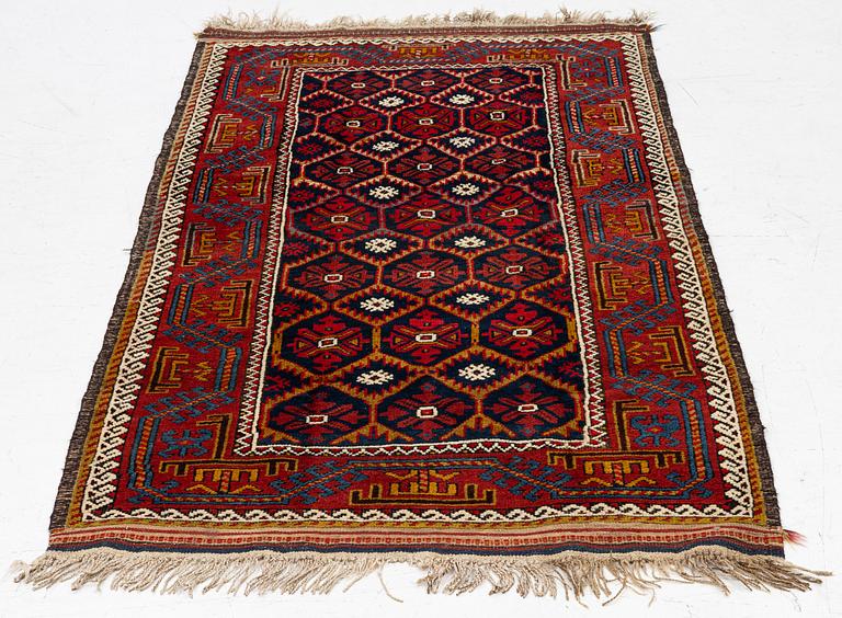An antique Baluch rug, east Persian, ca 203 x 101 cm.